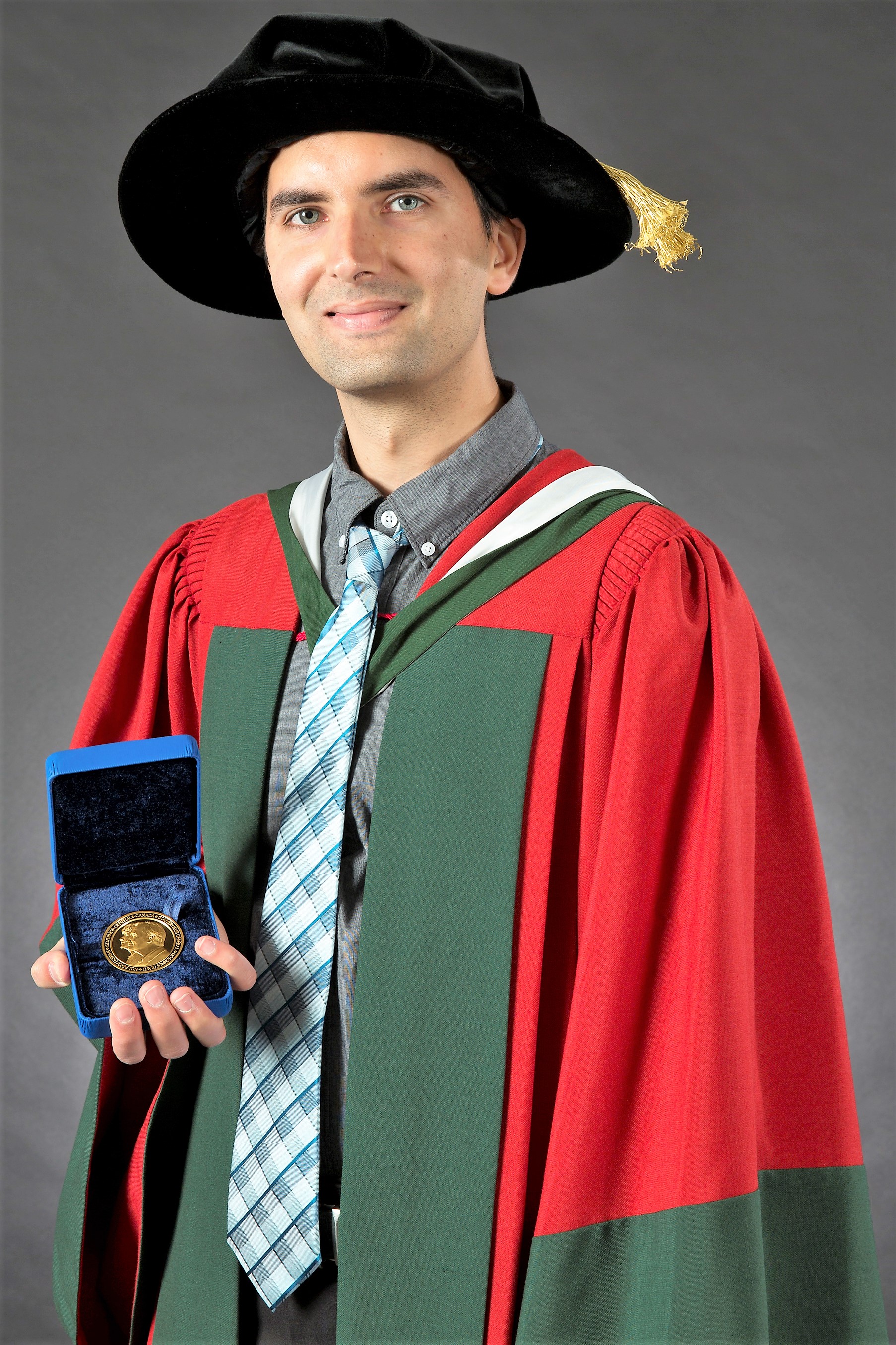 Photograph shows Abbas Mehrabian holding the Governor General’s gold medal in June 2015.