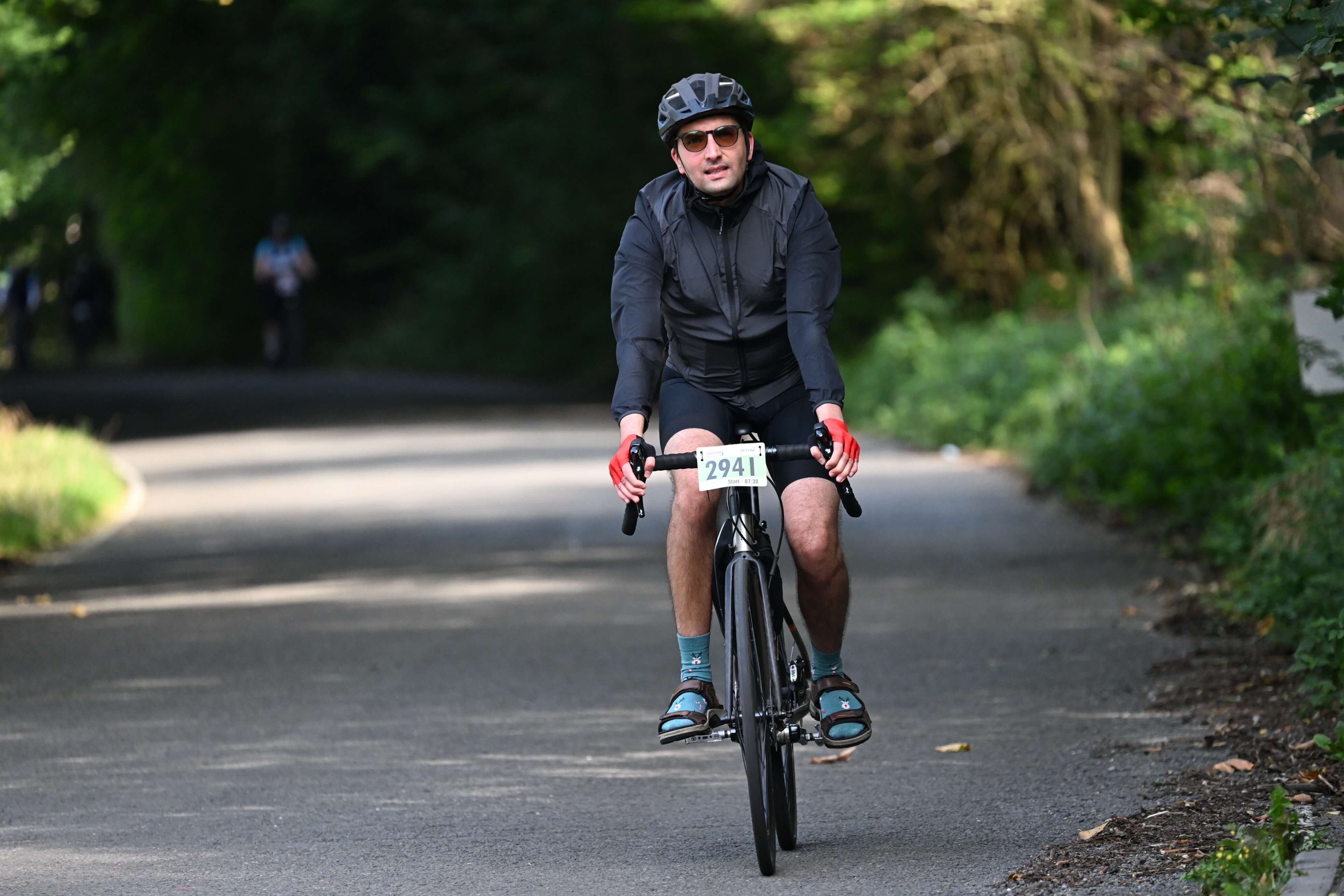 Photograph shows Abbas Mehrabian on a bicycle.